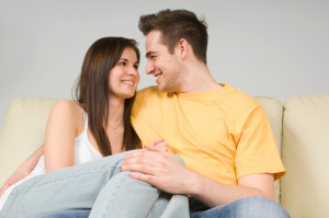 Couple embracing on couch