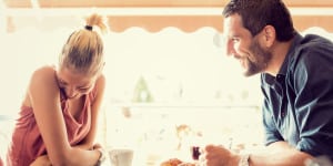 Young couple has breakfast at italian cafÃ©